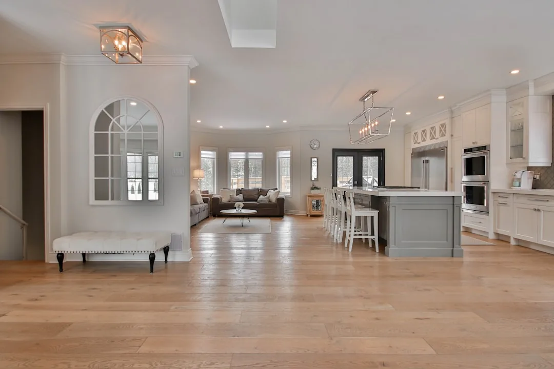 Modern American open-concept kitchen and living room interior, used as an example of home layout planning in square feet and square meters
